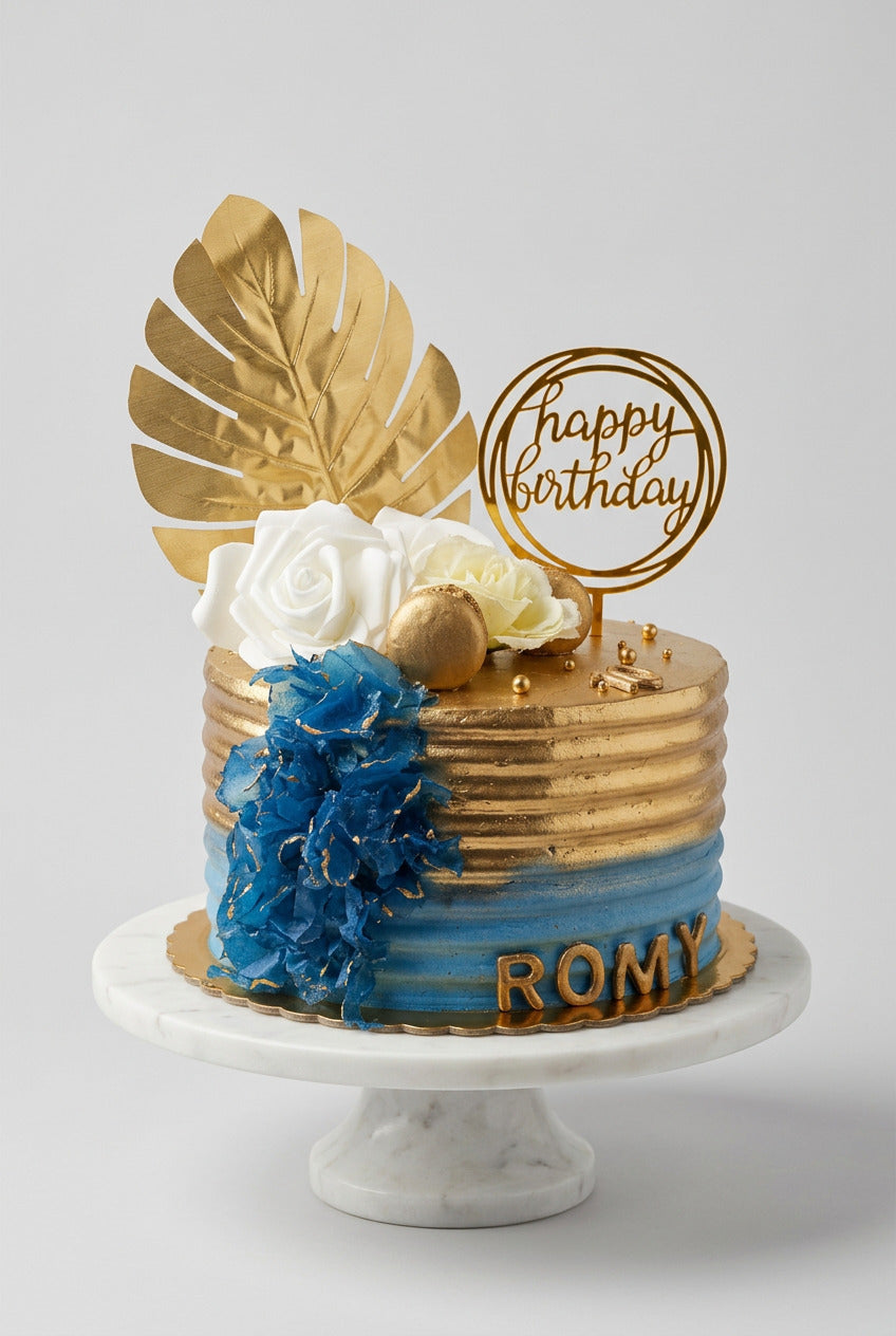 gâteau couleur or avec un fondu de bleu et une palme d or dessus 